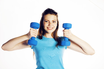 Image showing young pretty slim woman with dumbbell isolated cheerful smiling, real sport girl next door, lifestyle people concept