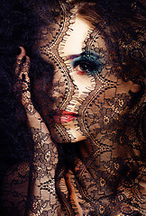 Image showing portrait of beauty young woman through lace close up mistery mak