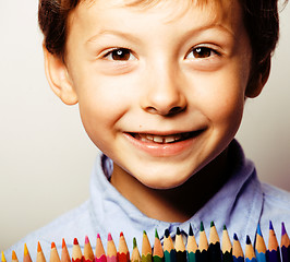 Image showing little cute boy with color pencils close up smiling, education f