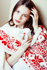 Image showing young pretty brunette girl in Christmas ornament blanket getting warm on cold winter, freshness beauty concept, lifestyle people