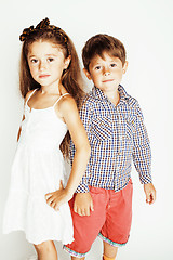 Image showing little cute boy and girl hugging playing on white background, happy smiling family, lifestyle people concept