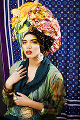 Image showing beauty bright woman with creative make up, many shawls on head l