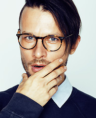 Image showing handsome middle age hipster man with modern hairstyle and tattoo, beard, close up on white background