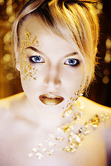 Image showing beauty blond woman with gold creative make up