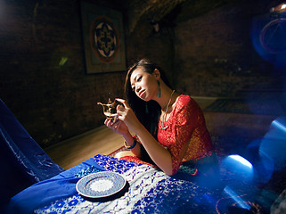 Image showing beautiful asian woman in oriental yoga indoor interior, fairy tale concept