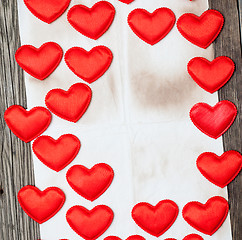 Image showing blank old paper with red hearts