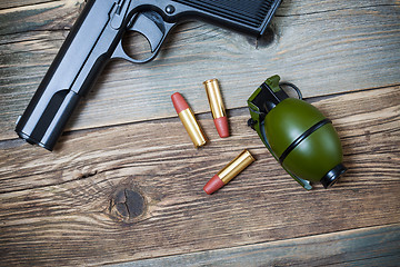 Image showing hand gun, grenade and cartridges