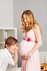 Image showing man listening pregnant belly