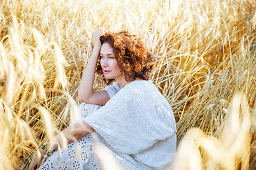 Image showing middle aged beautiful smiling woman in wheat field