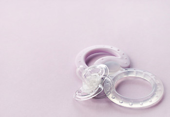 Image showing transparent pacifier on pink background