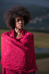 Image showing outdoor portrait of a black woman with a scarf