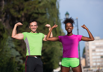 Image showing portrait of young multietnic jogging couple ready to run