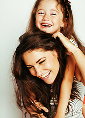 Image showing bright picture of hugging mother and daughter happy together, smiling stylish family. lifestyle people concept