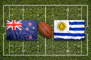 Image showing New Zealand vs. Uruguay flags on rugby field