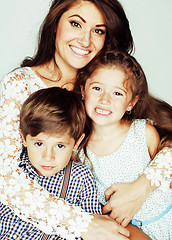 Image showing young mother with two children on white background isolated, happy smiling family, lifestyle people concept