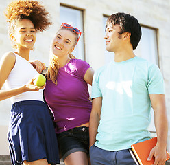 Image showing cute group of teenages at the building of university with books huggings, back to school