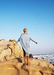 Image showing beauty young woman among rocks at sea dreaming relaxing