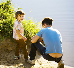 Image showing happy smiling little boy with father having fun on summer vacations, lifestyle people concept