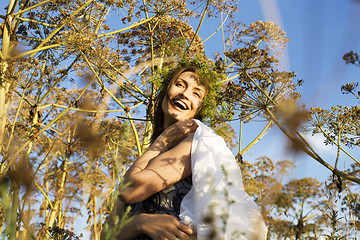 Image showing young cute summer girl on green grass outside relaxing happy smiling close up, lifestyle people concept