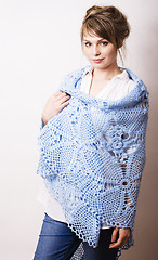 Image showing pretty young blond real woman with wool wrap in studio on white 