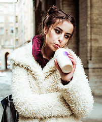 Image showing young pretty stylish teenage girl outside on city street fancy f