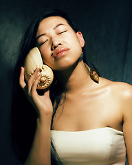 Image showing young asian vietnamese girl with shell, art people concept