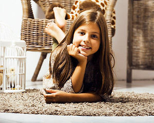 Image showing little cute brunette girl at home interior happy smiling close u