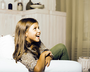 Image showing little cute brunette girl at home interior happy smiling close u