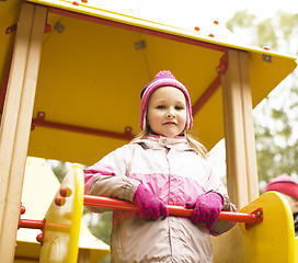 Image showing little cute girl playing outside on playground, lifestyle people concept