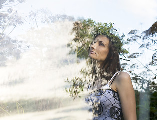 Image showing portrait of pretty young woman in field with high grass enjoing nature, double exposure concept