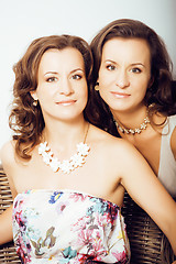 Image showing mature woman sisters twins at home interior, lifestyle people concept