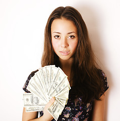 Image showing pretty young brunette real modern woman with money cash isolated on white background happy smiling, lifestyle people concept