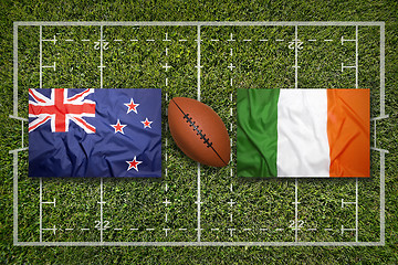 Image showing New Zealand vs. Ireland flags on rugby field