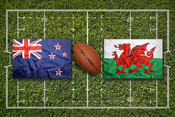 Image showing New Zealand vs. Wales flags on rugby field