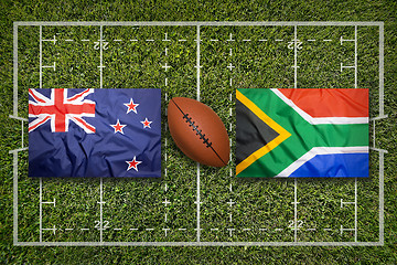 Image showing New Zealand vs. South Africa flags on rugby field