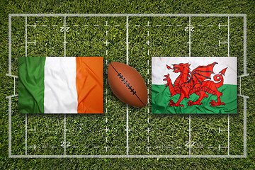 Image showing Ireland vs. Wales flags on rugby field