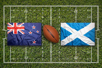 Image showing New Zealand vs. Scotland flags on rugby field