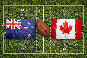 Image showing New Zealand vs. Canada flags on rugby field