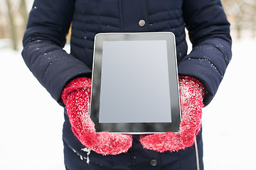 Image showing close up of woman with tablet pc in winter