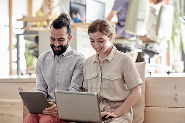 Image showing creative team with tablet pc and laptop in office