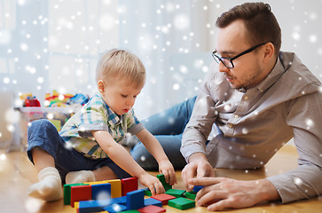 Image showing father and son playing with toy blocks at home