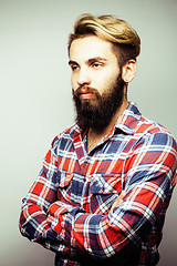 Image showing portrait of young bearded hipster guy smiling on white background close up, brutal man, lifestyle people concept