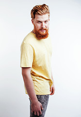 Image showing young handsome hipster ginger bearded guy looking brutal isolated on white background, lifestyle people concept