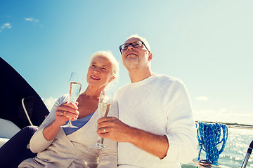 Image showing senior couple with glasses on sail boat or yacht