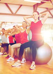 Image showing group of people working out in pilates class