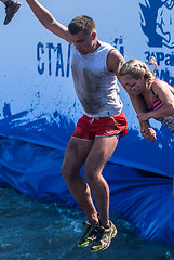 Image showing Man with girl jump in water in extrim racing