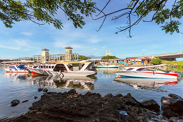 Image showing poor houses by the river in shantytown