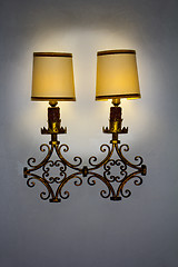 Image showing Old wall lamp made of metal with shade from canvas