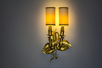 Image showing Old wall lamp made of metal with shade from canvas