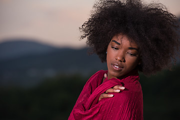 Image showing outdoor portrait of a black woman with a scarf